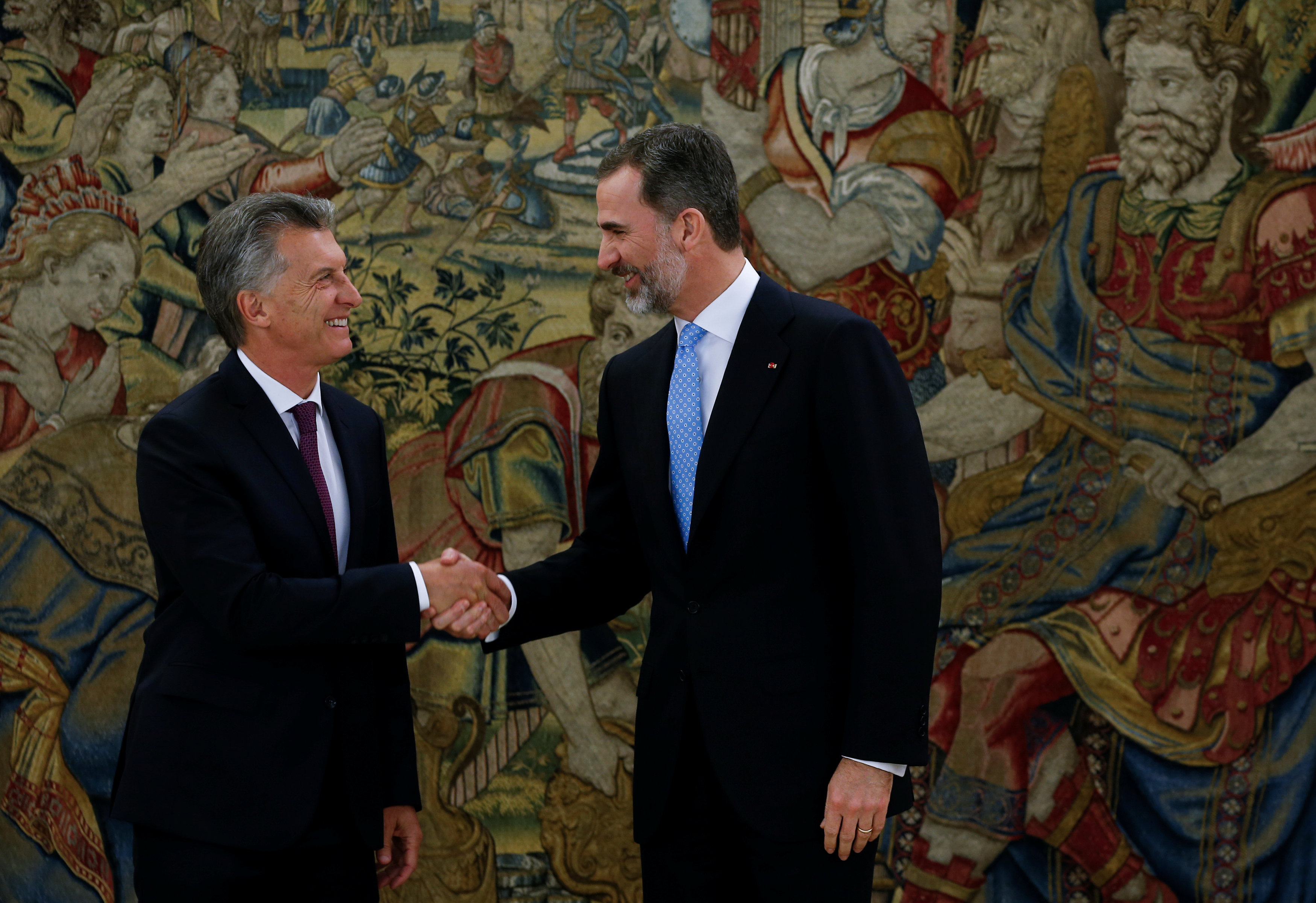 Spain's King Felipe and Argentina's President Macri shake hands before their lunch at the Zarzuela Palace in Madrid
