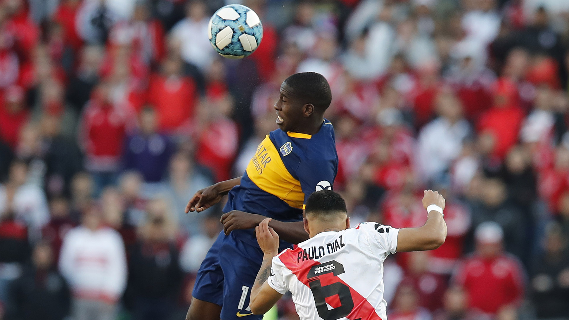 Boca Juniors' Jan Hurtado, top, heads the ball challenged by River Plate's Paulo Diaz during their Argentine first division soccer game in Buenos Aires, Argentina, Sunday, Sept. 1, 2019. (AP Photo/Natacha Pisarenko) Boca Juniors' Jan Hurtado, top, heads the ball challenged by River Plate's Paulo Diaz during their Argentine first division soccer game in Buenos Aires, Argentina, Sunday, Sept. 1, 2019. (AP Photo/Natacha Pisarenko)